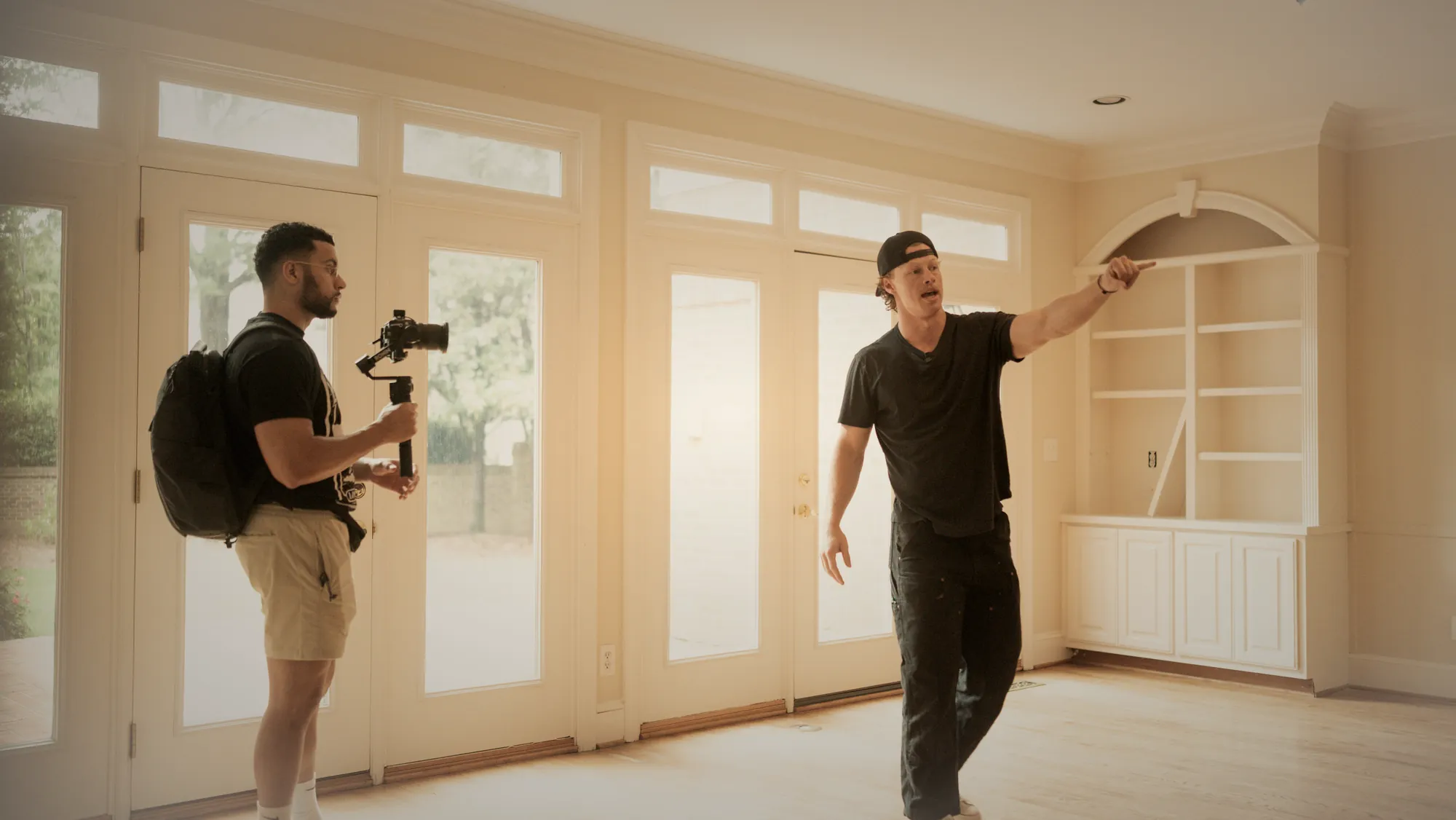 Filming a property tour on a gimbal while the owner walks the space