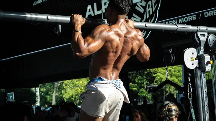 Athlete doing pull-ups at an outdoor gym