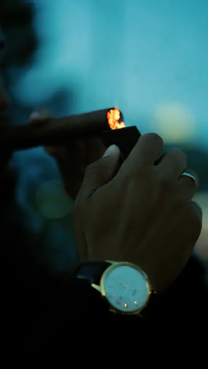 Watch on a wrist, lit in low blue light